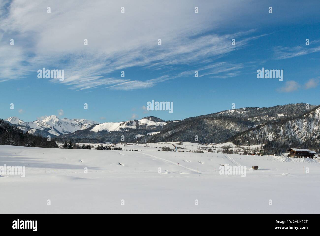 winter landscape with a snow-covered house in the ski area reit im winkl,bavaria Stock Photo