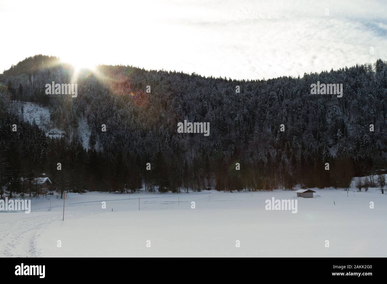 winter landscape with a snow-covered houses in the ski area reit im winkl,bavaria Stock Photo
