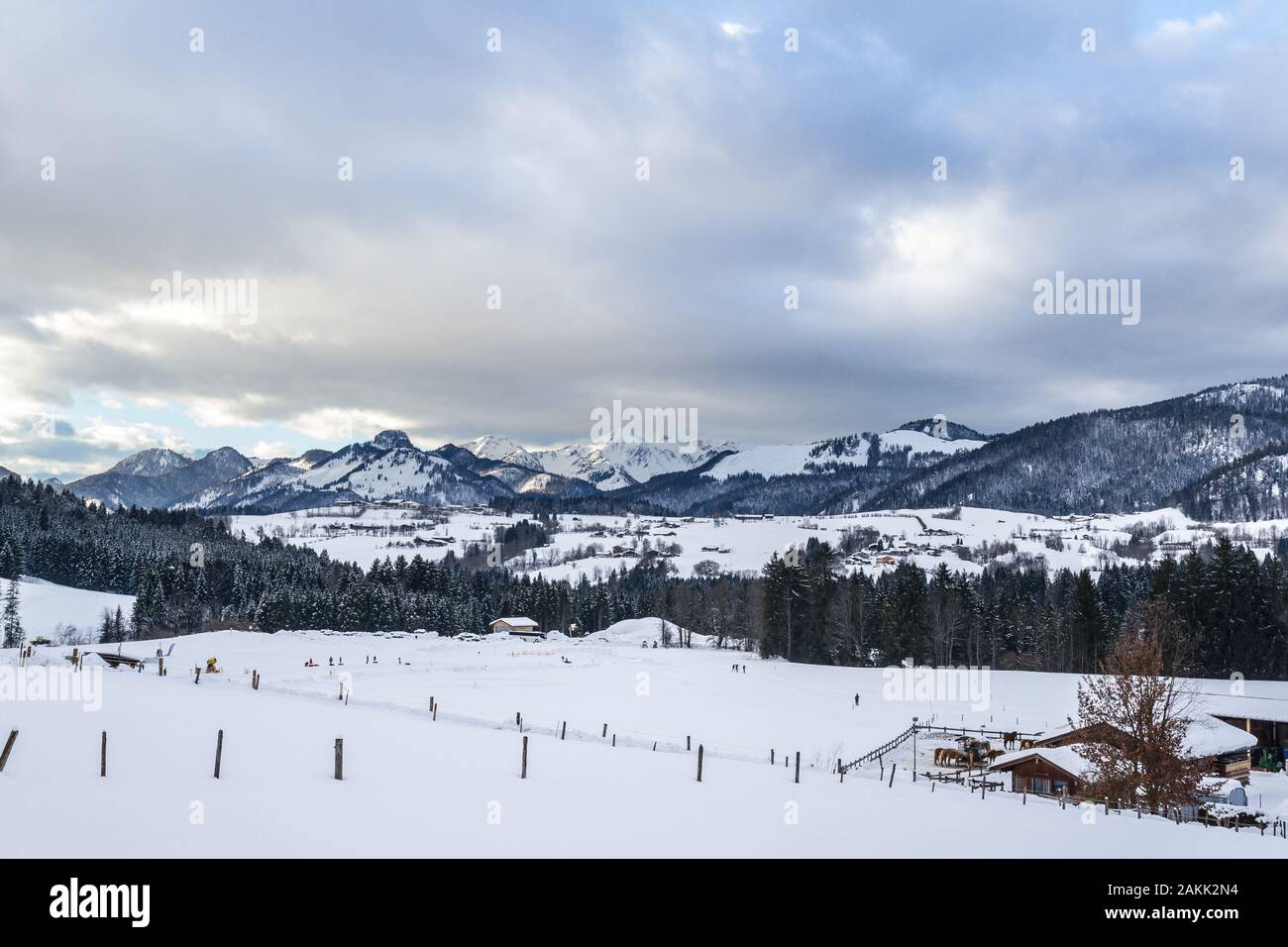 snow-covered winter landscape with a trail in the ski area reit im winkl, bavaria Stock Photo