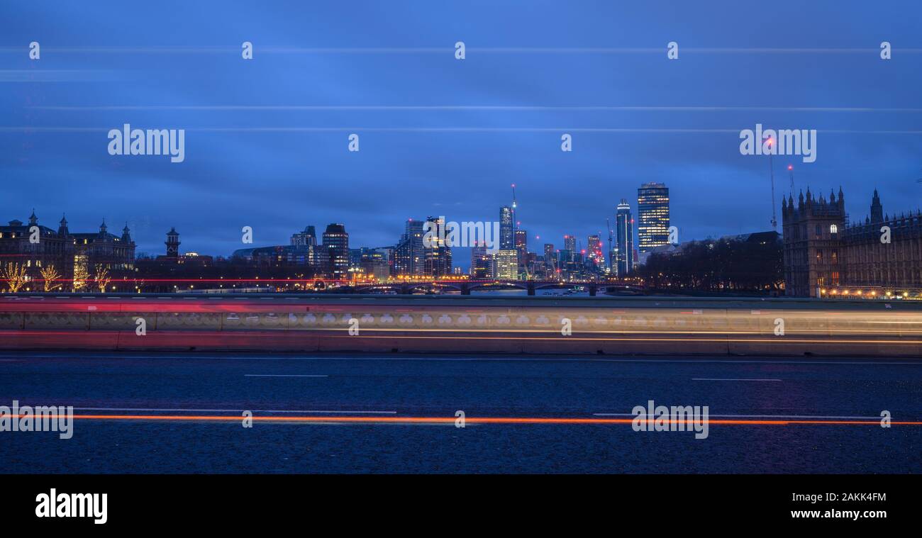 River Thames, London, UK. 9th January 2020. UK Weather: Light trails along Westminster Bridge with the lights of the rapidly changing Vauxhall skyline in the background on a dull and grey January morning. Credit: Celia McMahon/Alamy Live News. Stock Photo