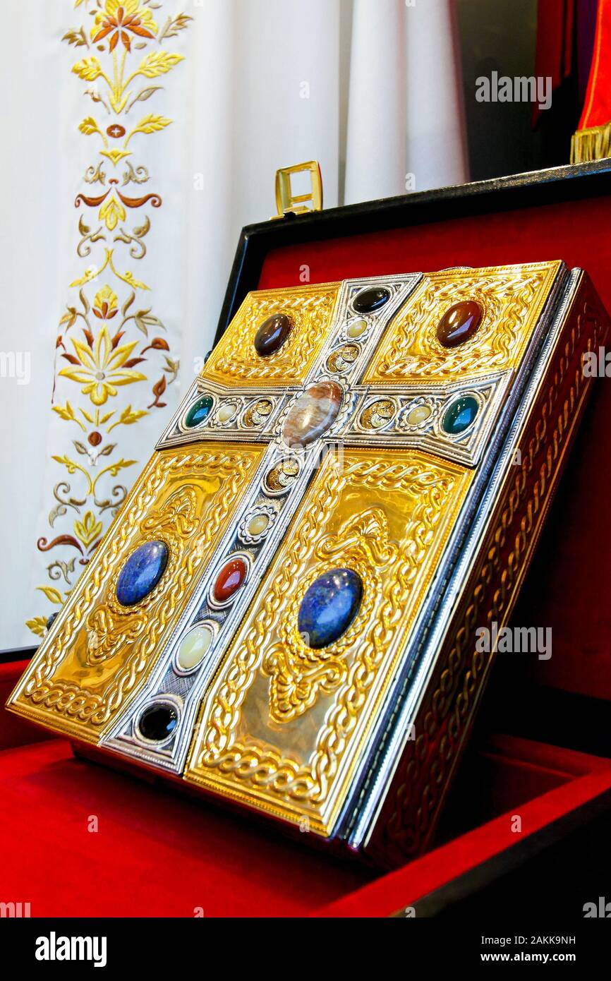 Holy Bible book in gold with cross Stock Photo Alamy