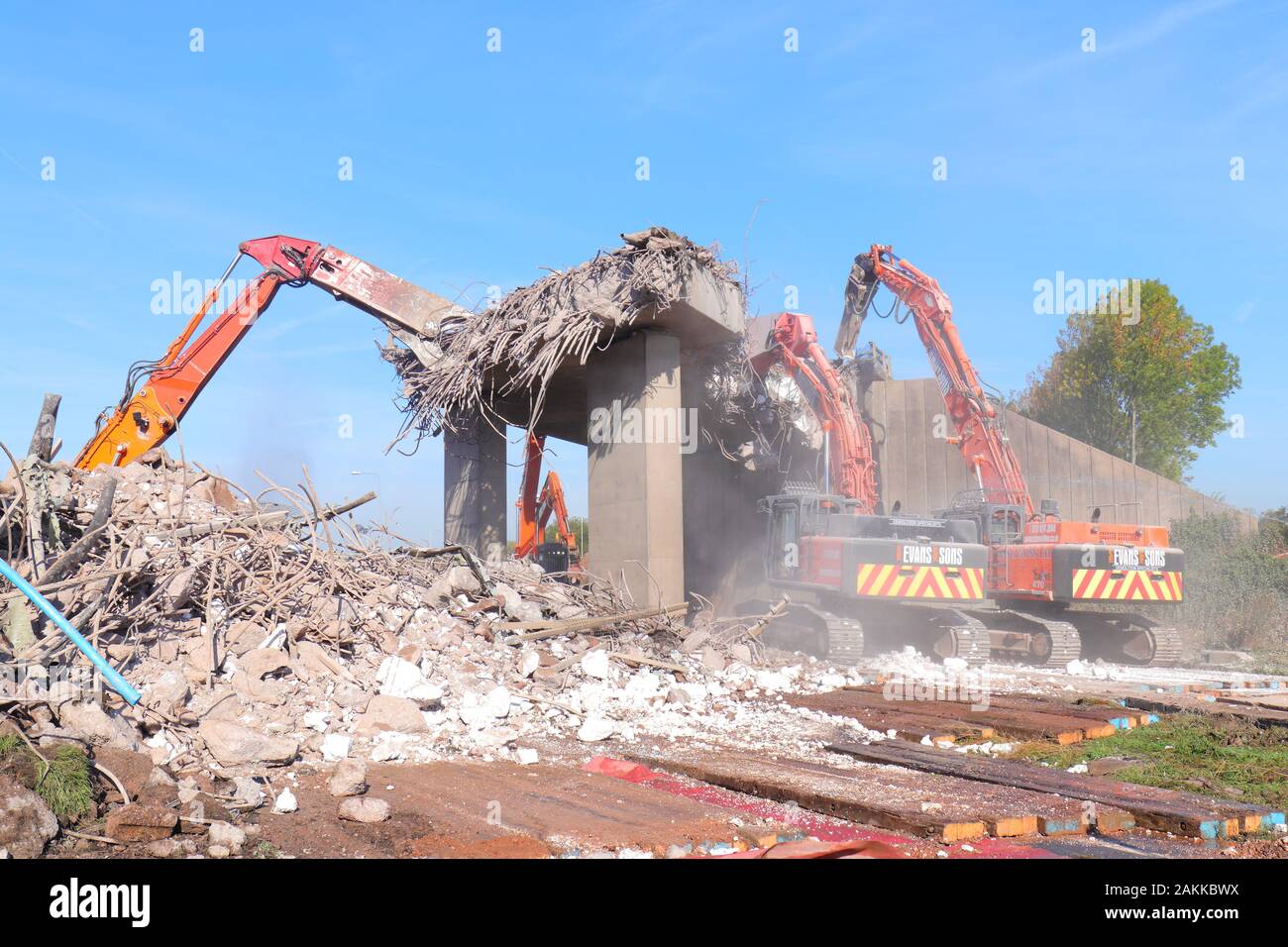 Machines at work on the demolition of a bridge across the A50 in Uttoxeter. Stock Photo