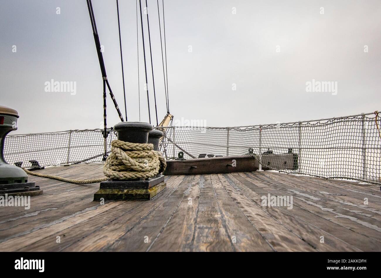 Deck of an Old Vintage Wooden Fishing Boat with Capstan Stock
