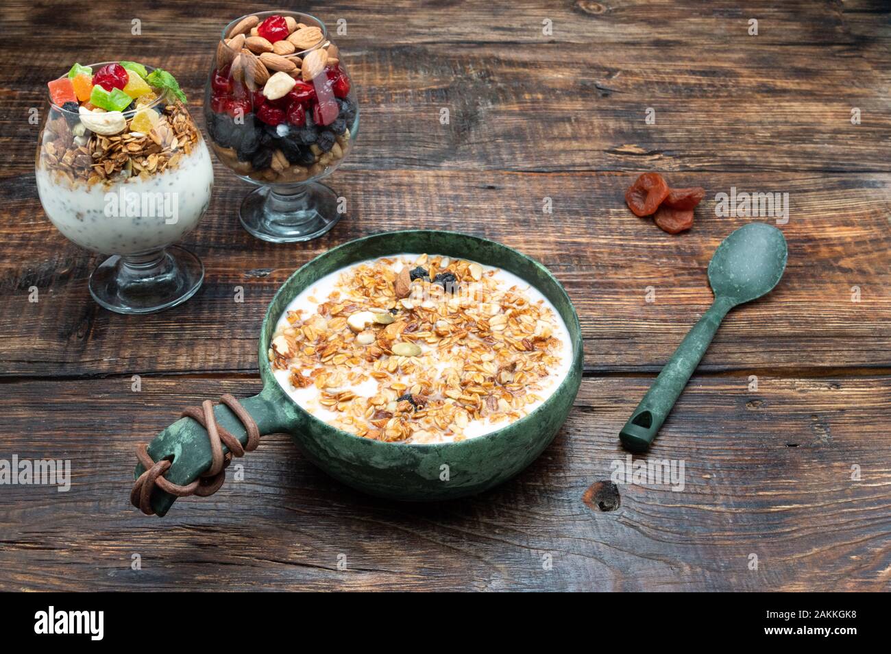 Bowl with yogurt and dried fruits. Breakfast with muesli Stock Photo