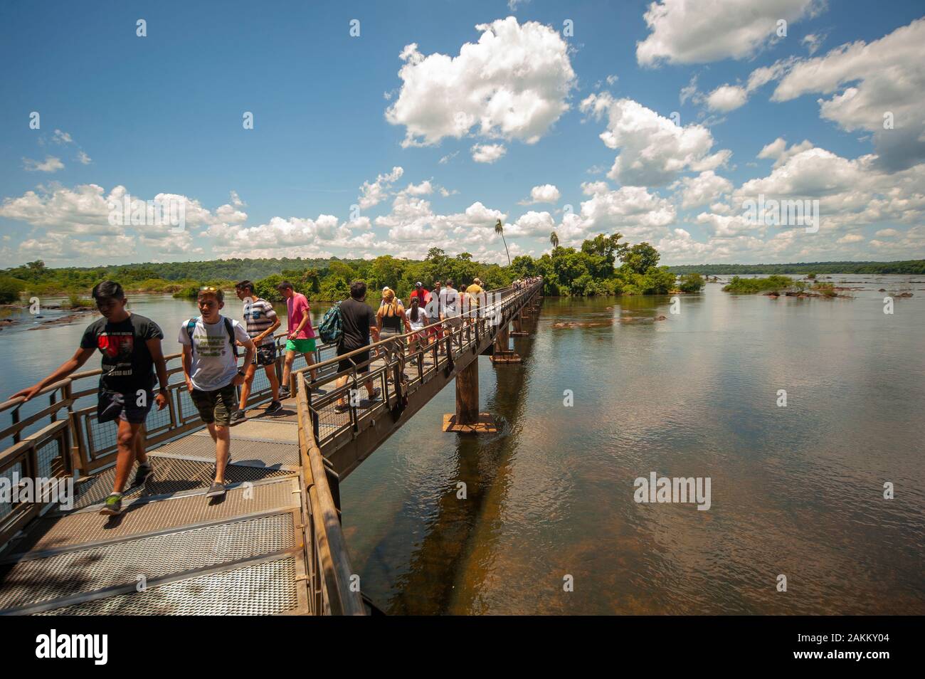 Tourists walking on the sidewalk that leads to the Devil's Throat on the Iguazu National Park, Argentina Stock Photo