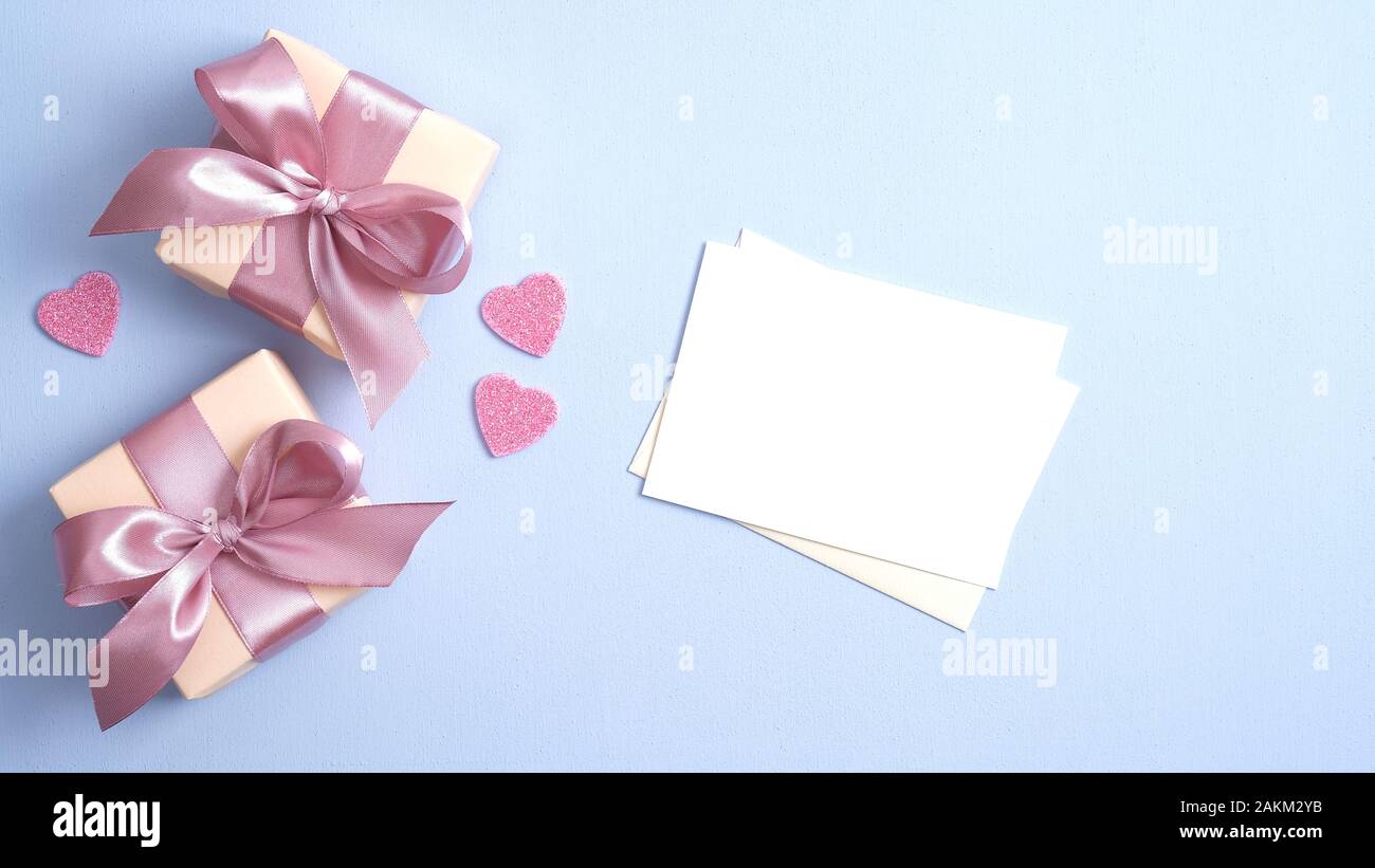 Valentine gift boxes with pink ribbon bow and romantic love letter on ...
