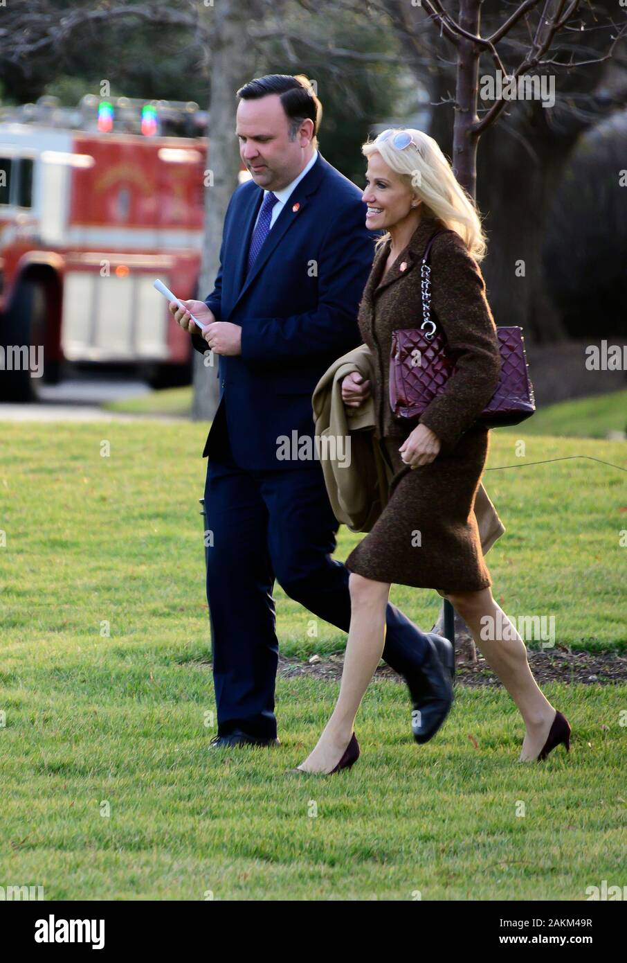 White House Director of Social Media Dan Scavino, left, and Senior Counselor Kellyanne Conway, right, follow United States President Donald J. Trump to Marine One as he departs the White House in Washington, DC en route to Toledo, Ohio to deliver remarks at a Keep America Great Rally on Thursday, January 9, 2020. Credit: Ron Sachs/CNP | usage worldwide Stock Photo