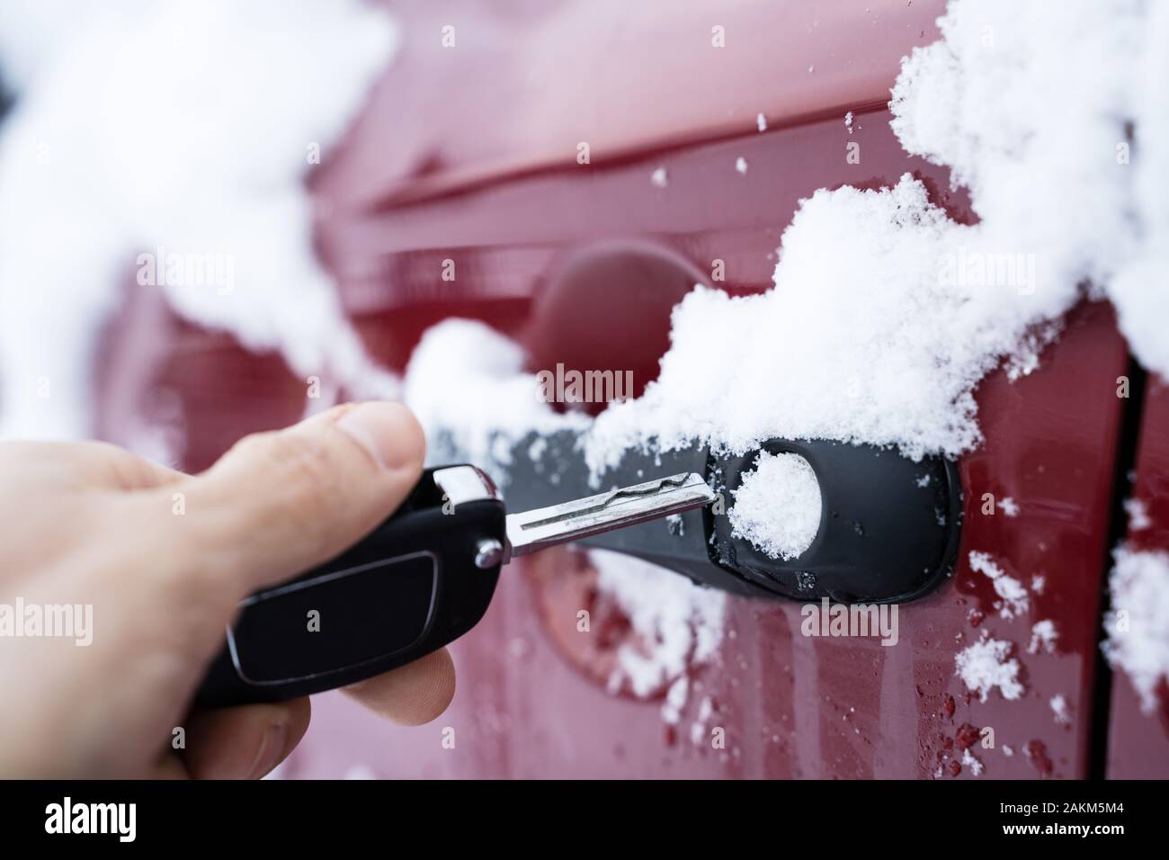 Man Trying To Open Frozen Car Door With Key Stock Photo Alamy