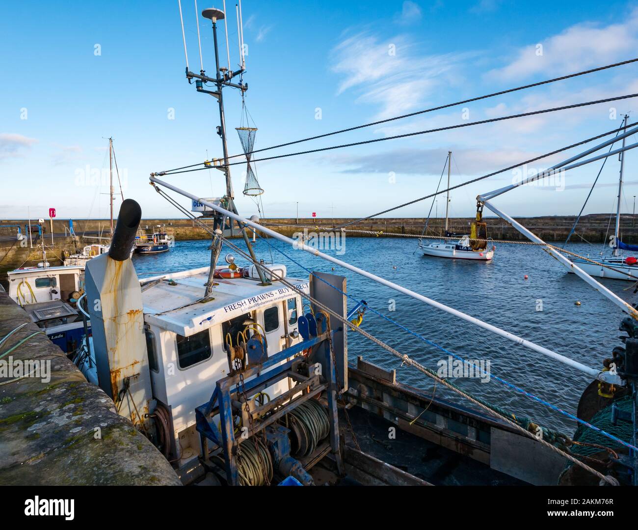 Fishing boat moored in harbour with advert for fresh prawns, Fisherrow Harbour, Musselburgh, Scotland, UK Stock Photo