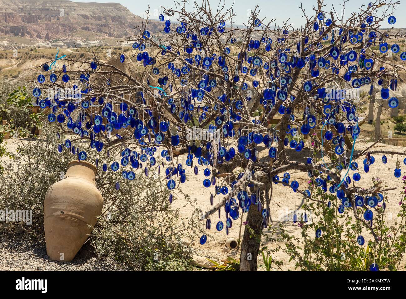 Tree with several evil eye glass disks hanging from it in Cappadocia, Turkey Stock Photo