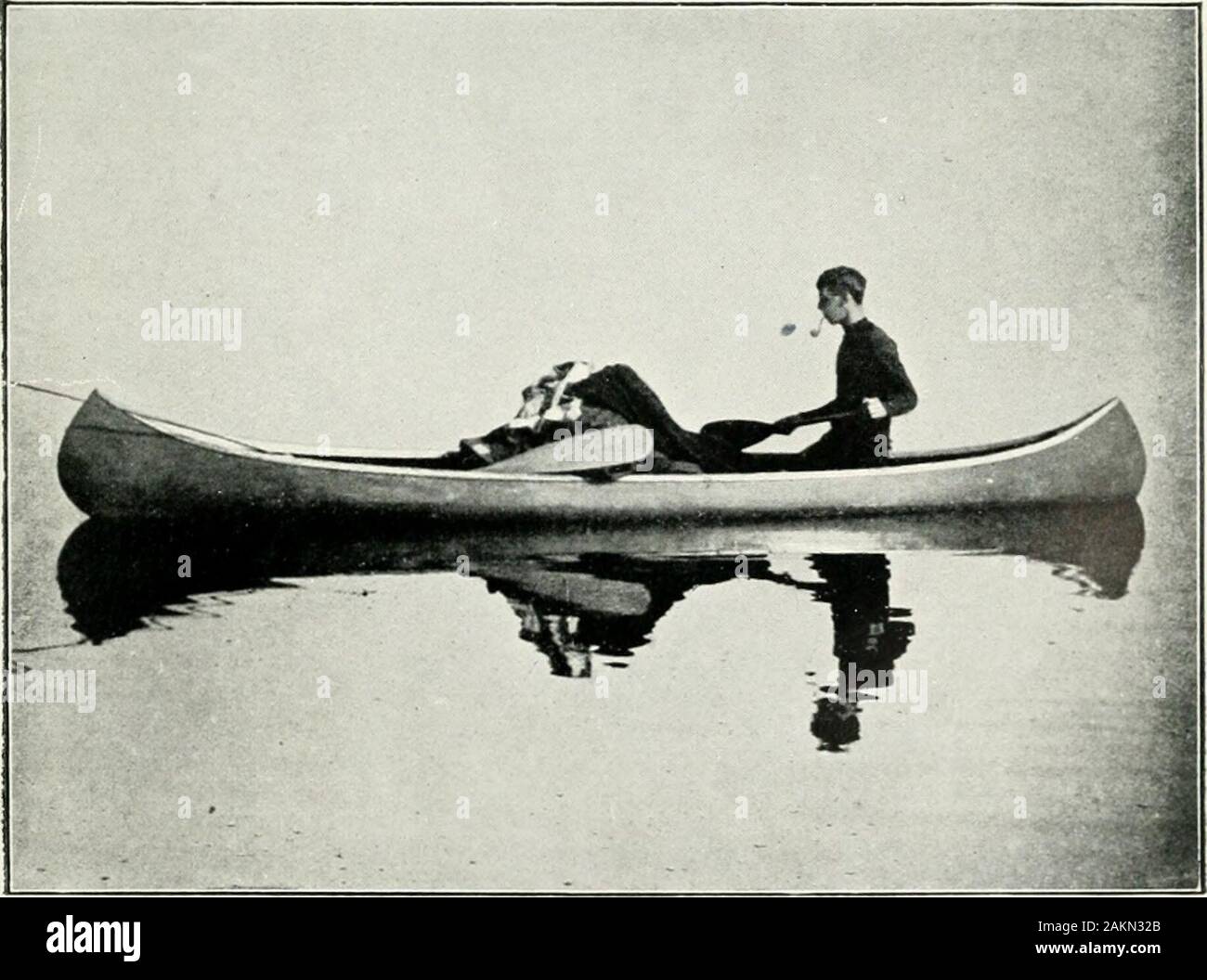 Newfoundland in 1911, being the coronation year of King George Vand the opening of the second decade of the twentieth century . Photo.] Marble Head—Humber River. [Honoicay.. Photo.] Paddling along a Steady. lUolloivay. Stock Photo