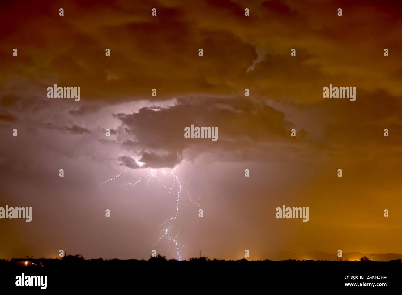 A bolt of lightning illuminating a late night dust storm in Arizona during the 2011 Monsoon season. Stock Photo