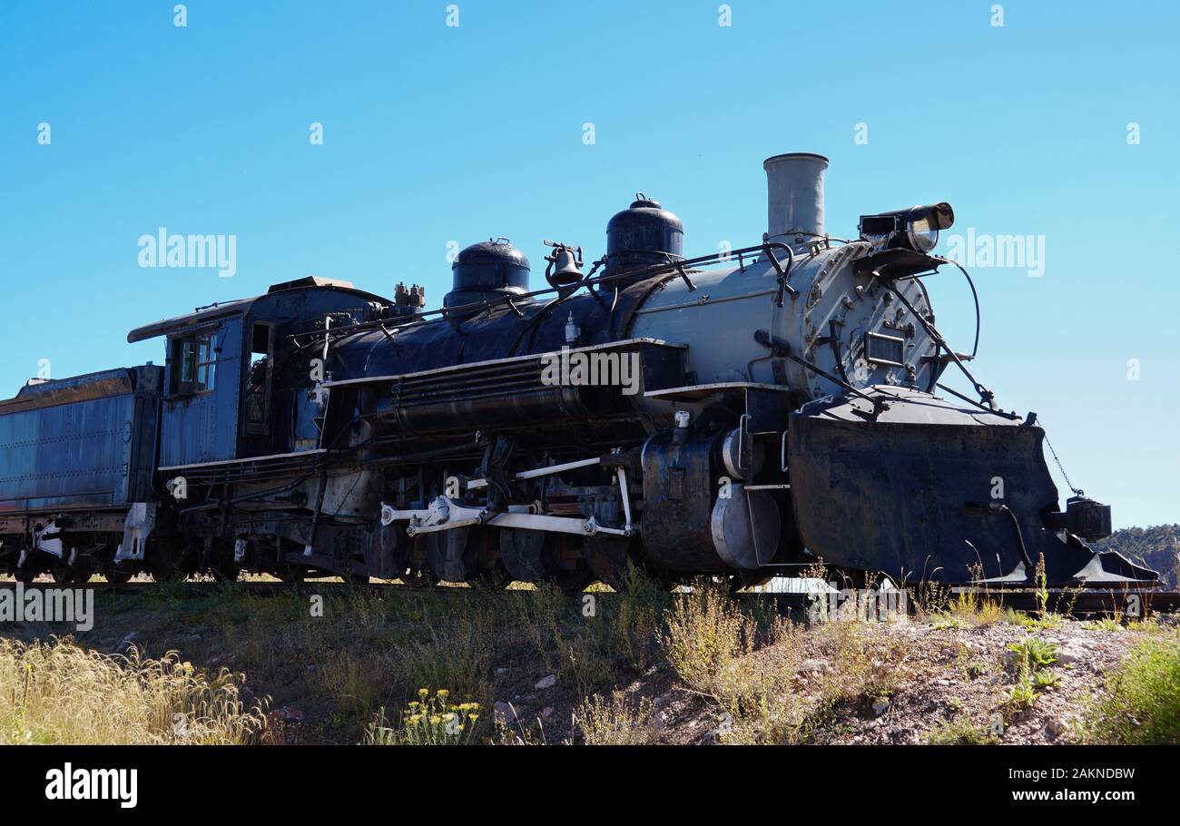 Side view of an old steam locomotive engine and one of it's cars. Stock Photo