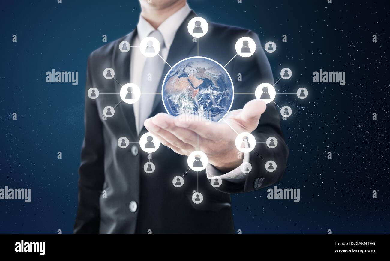 Global networking and global business network. Businessman holding globe with social networking icons. Element of this image are furnished by NASA Stock Photo