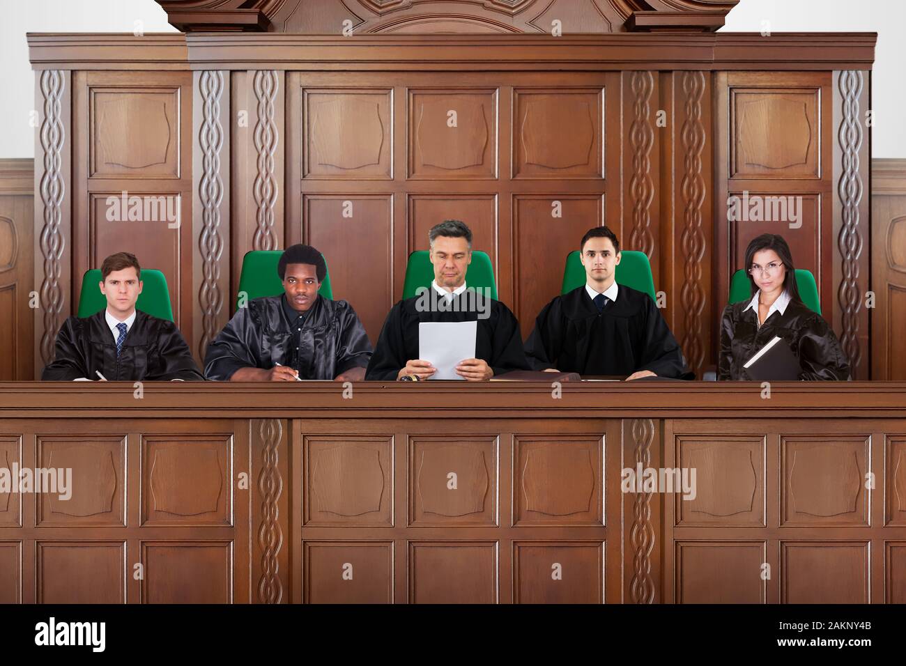 Judges Sitting In A Courtroom During Trial Hearings Stock Photo