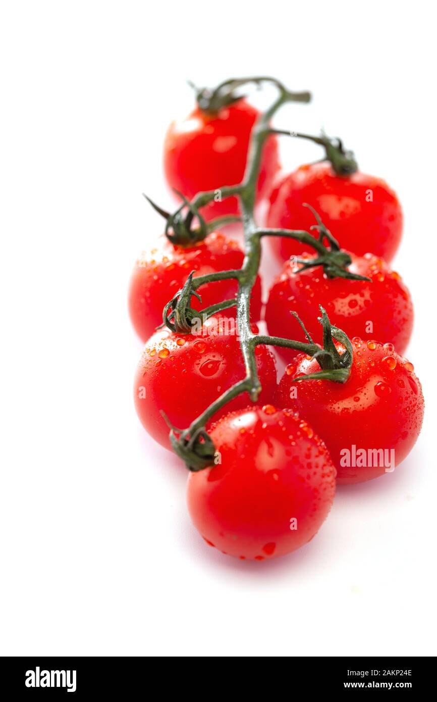 Close up bunch tomatoes vertical hi-res stock photography and images ...