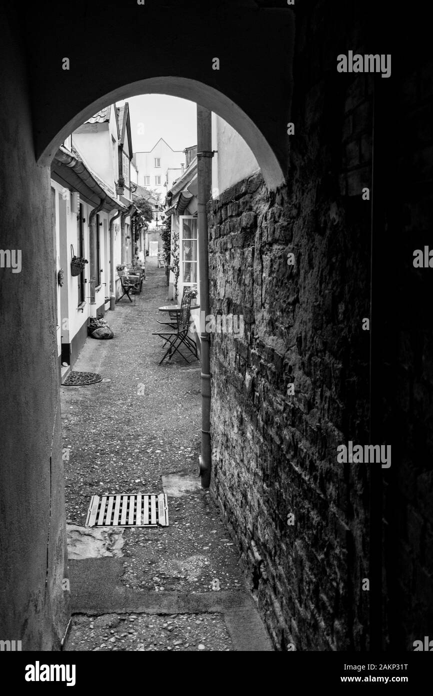 The charming corridors of Lubeck in black and white Stock Photo
