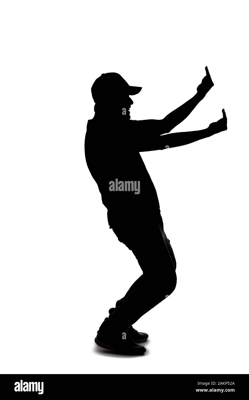 Silhouette of a man wearing casual clothes isolated on a white background. He is being rude and angry Stock Photo