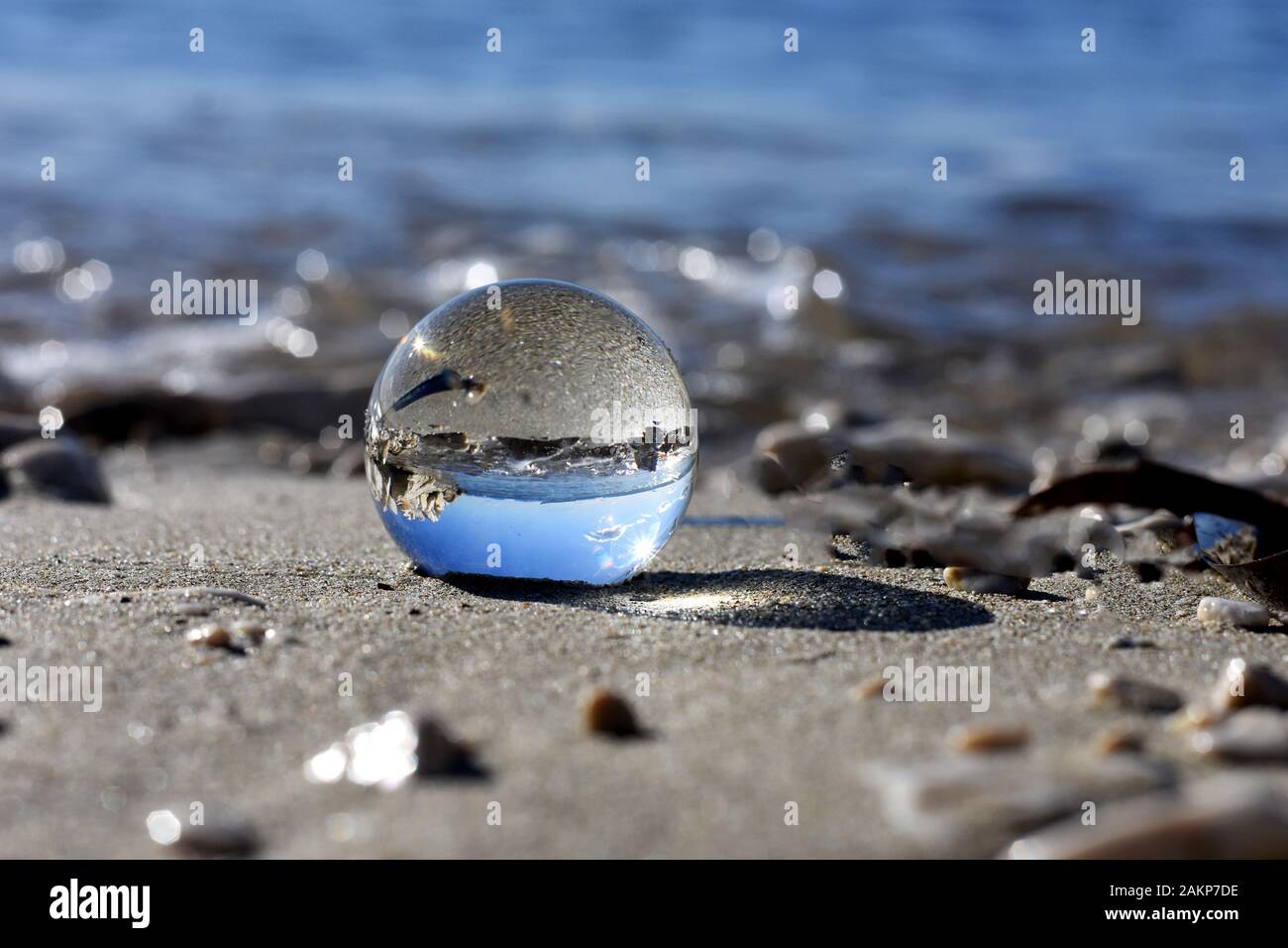 Beautiful transparent glass balls at the beach flips the view upside down/ beautiful landscape nature photography Stock Photo