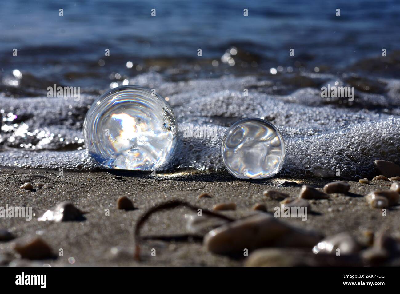 Beautiful transparent glass balls at the beach flips the view upside down/ beautiful landscape nature photography Stock Photo