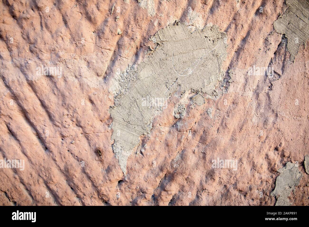 Exterior wall repair. Damaged by cracks. Textured background