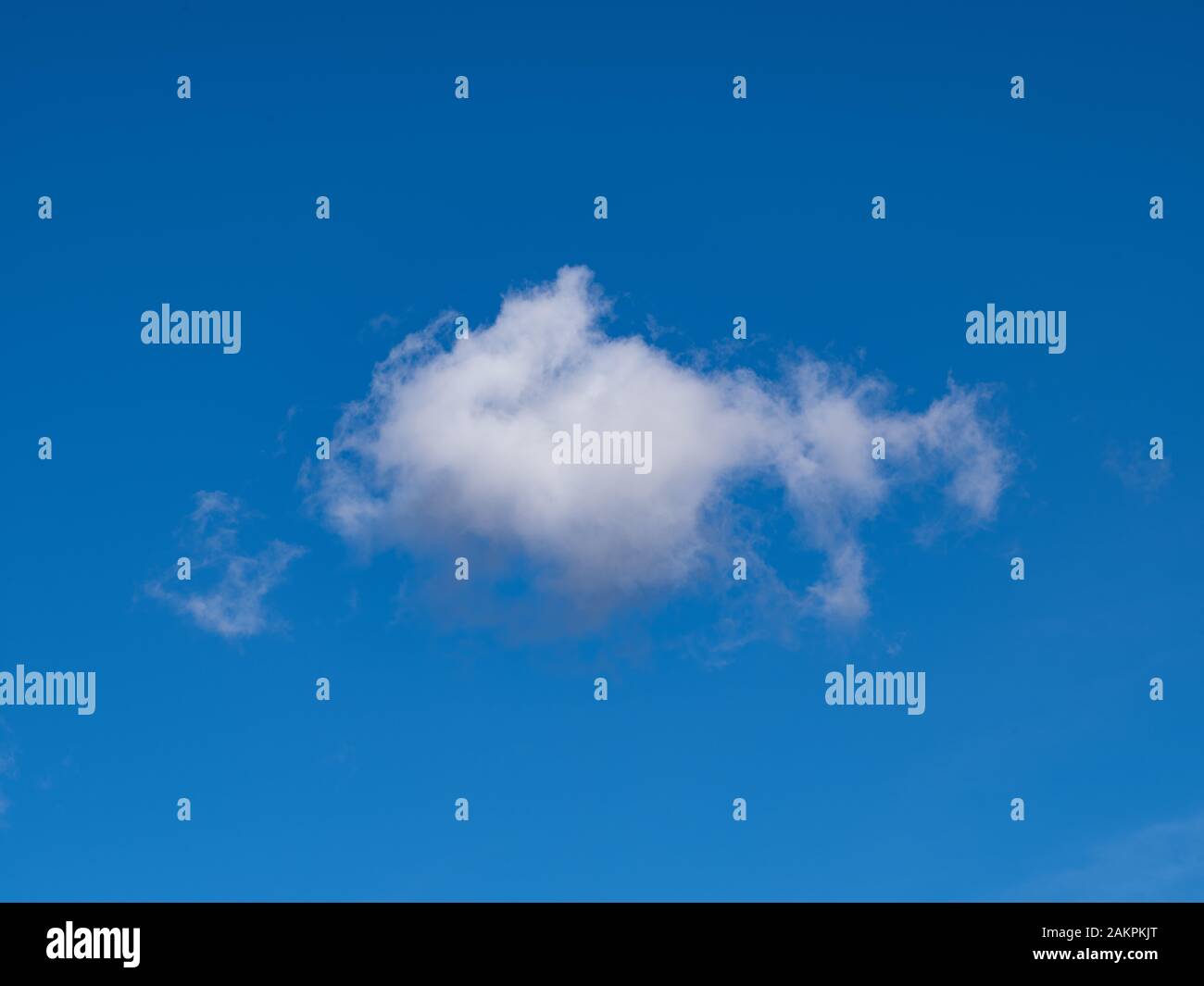 Isolated Cloud Against Blue Sky Stock Photo