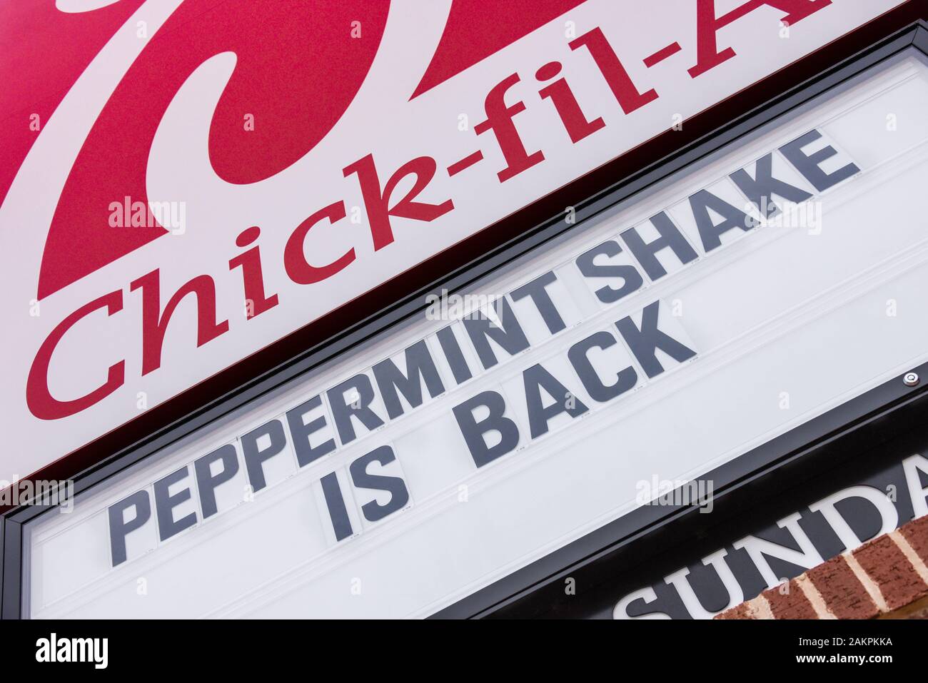 Chick-fil-A restaurant sign announcing the return of their peppermint milkshake. (USA) Stock Photo