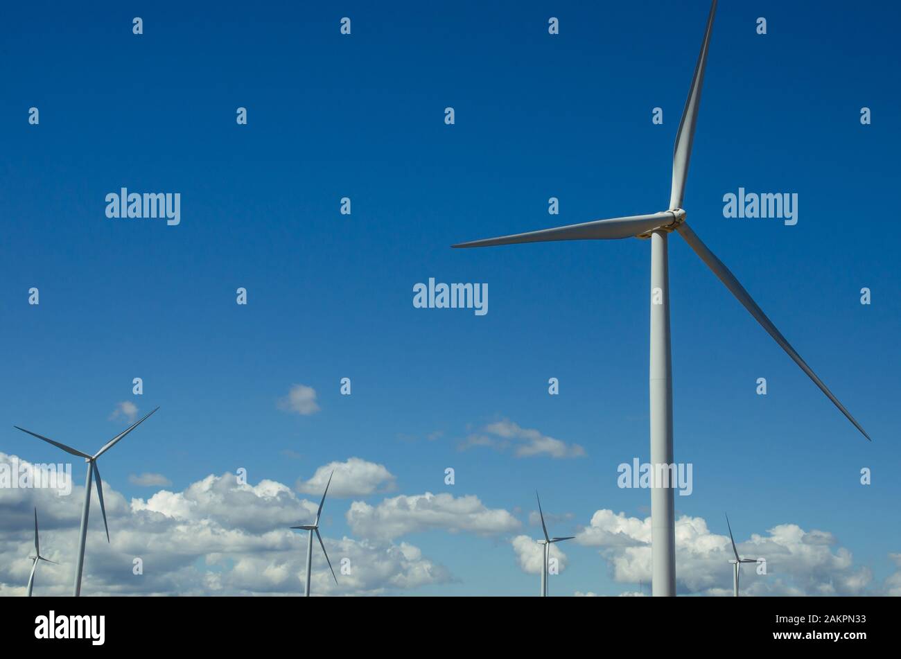 wind turbines with blue sky background Stock Photo - Alamy