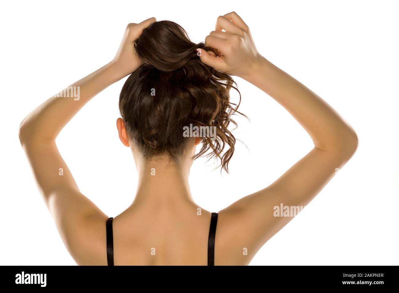 Woman Tying Back Her Hair Stock Photos Woman Tying Back Her Hair
