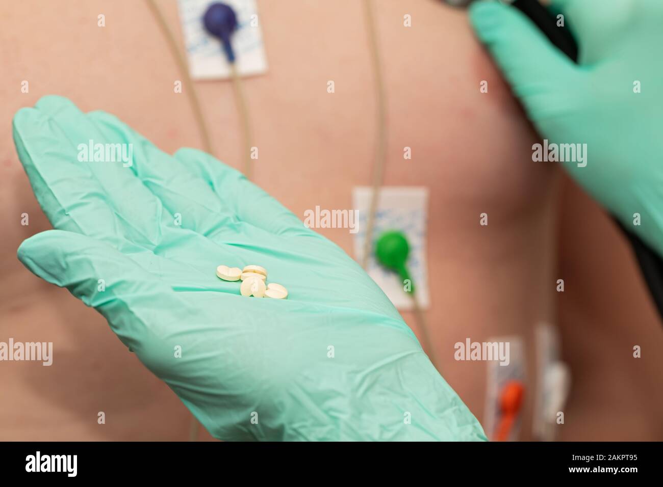 Young man with  heart diseases wearing holter monitor device for an electrocardiogram Stock Photo