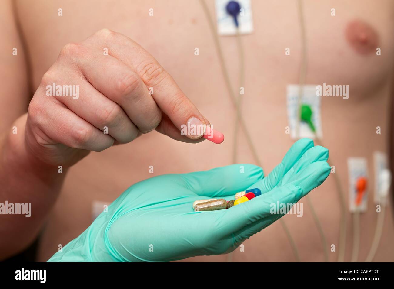 Young man with  heart diseases wearing holter monitor device for an electrocardiogram Stock Photo
