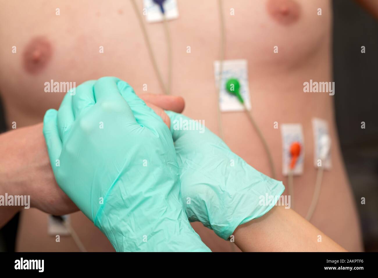 Nurse holding hands to a patient with heart disease Stock Photo