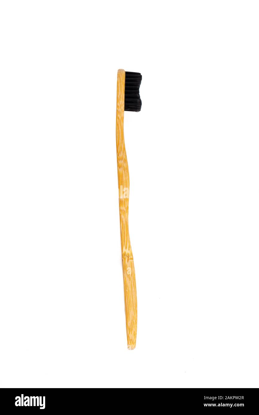 Bamboo toothbrush on white background Stock Photo - Alamy