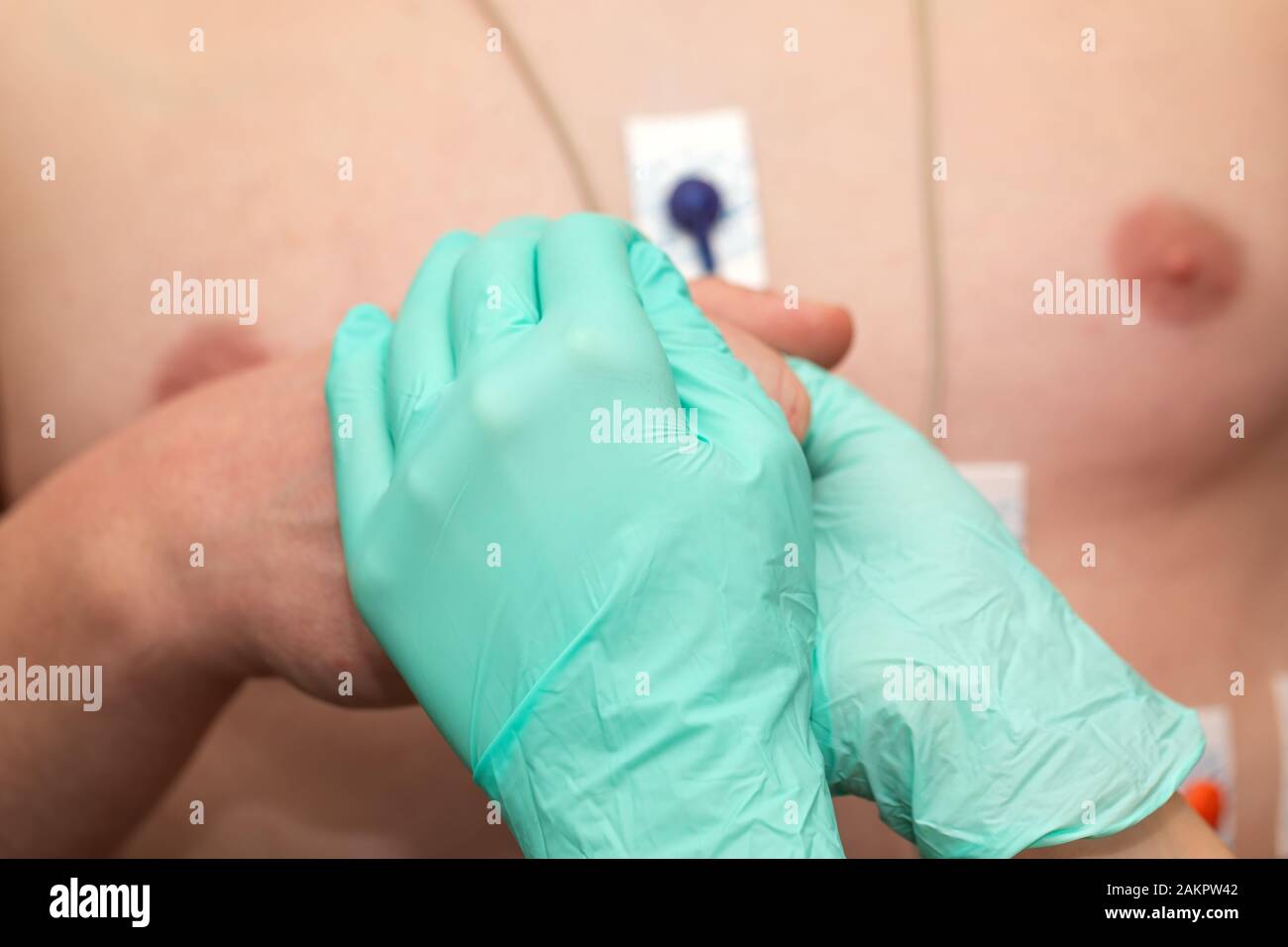 Nurse holding hands to a patient with heart disease Stock Photo