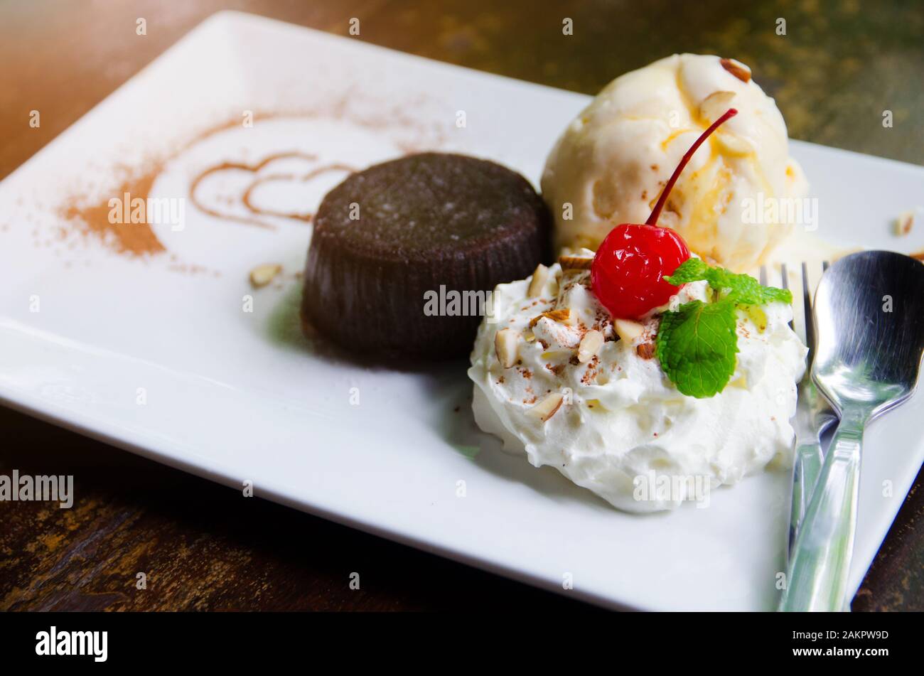 vanilla ice cream and brownie on white plate Stock Photo - Alamy