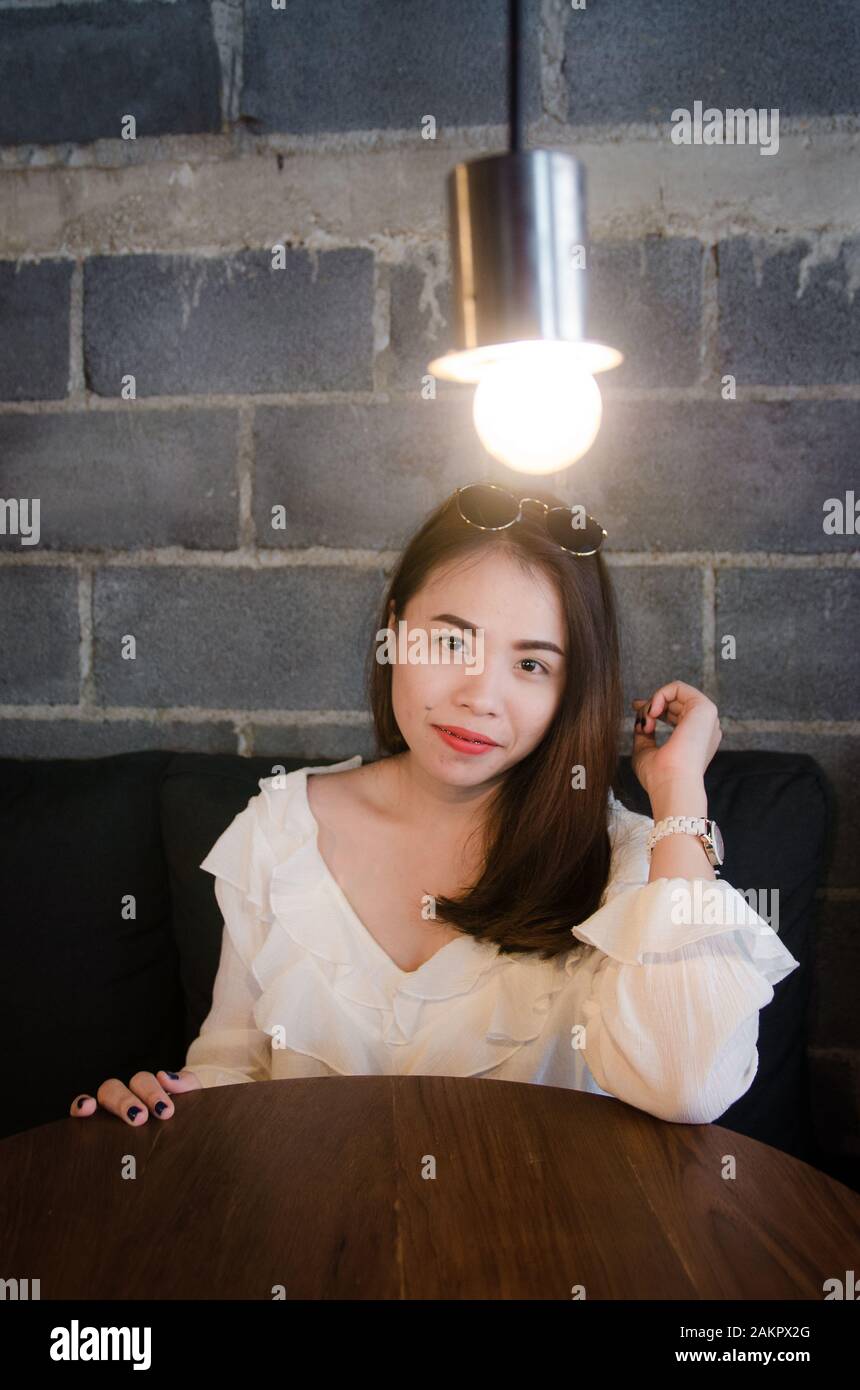 asian pretty girl sitting in cafe with happiness face Stock Photo - Alamy