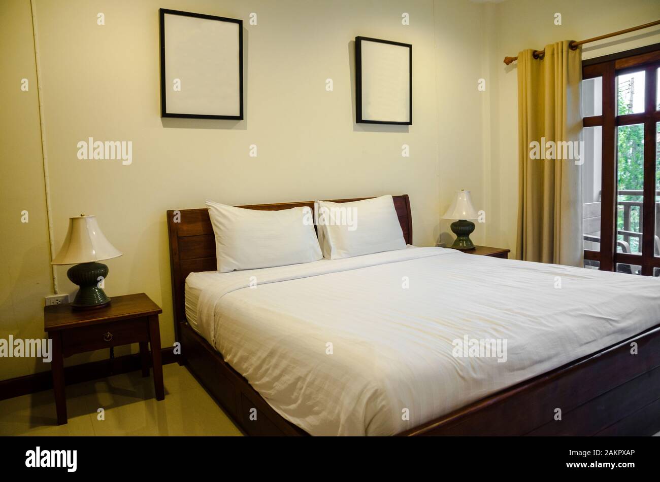 interior of bedroom with white bed Stock Photo - Alamy