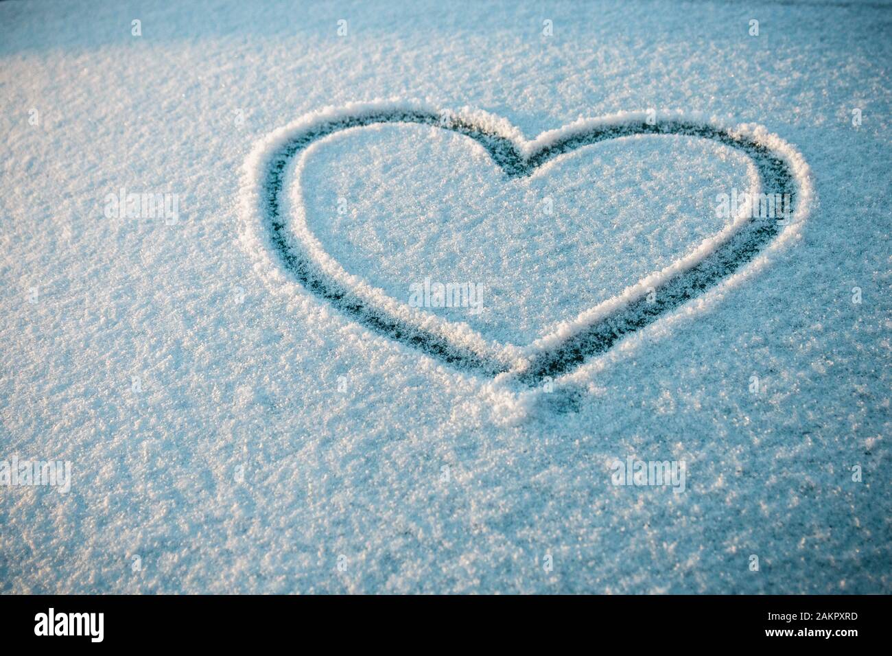 Drawn Heart Shape On Snow Concept Of Love Stock Photo Alamy