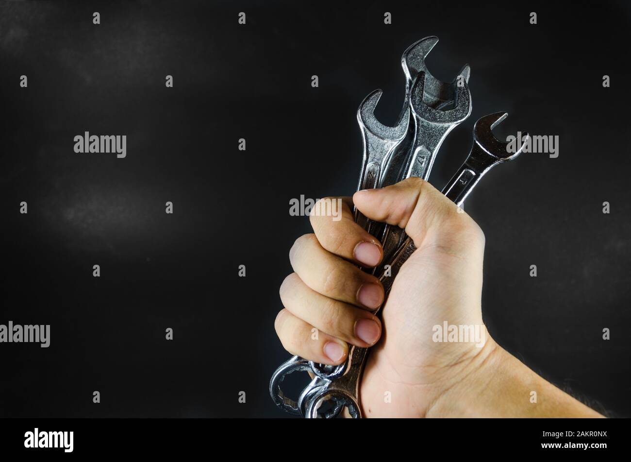 hand hold wrench on blackground Stock Photo