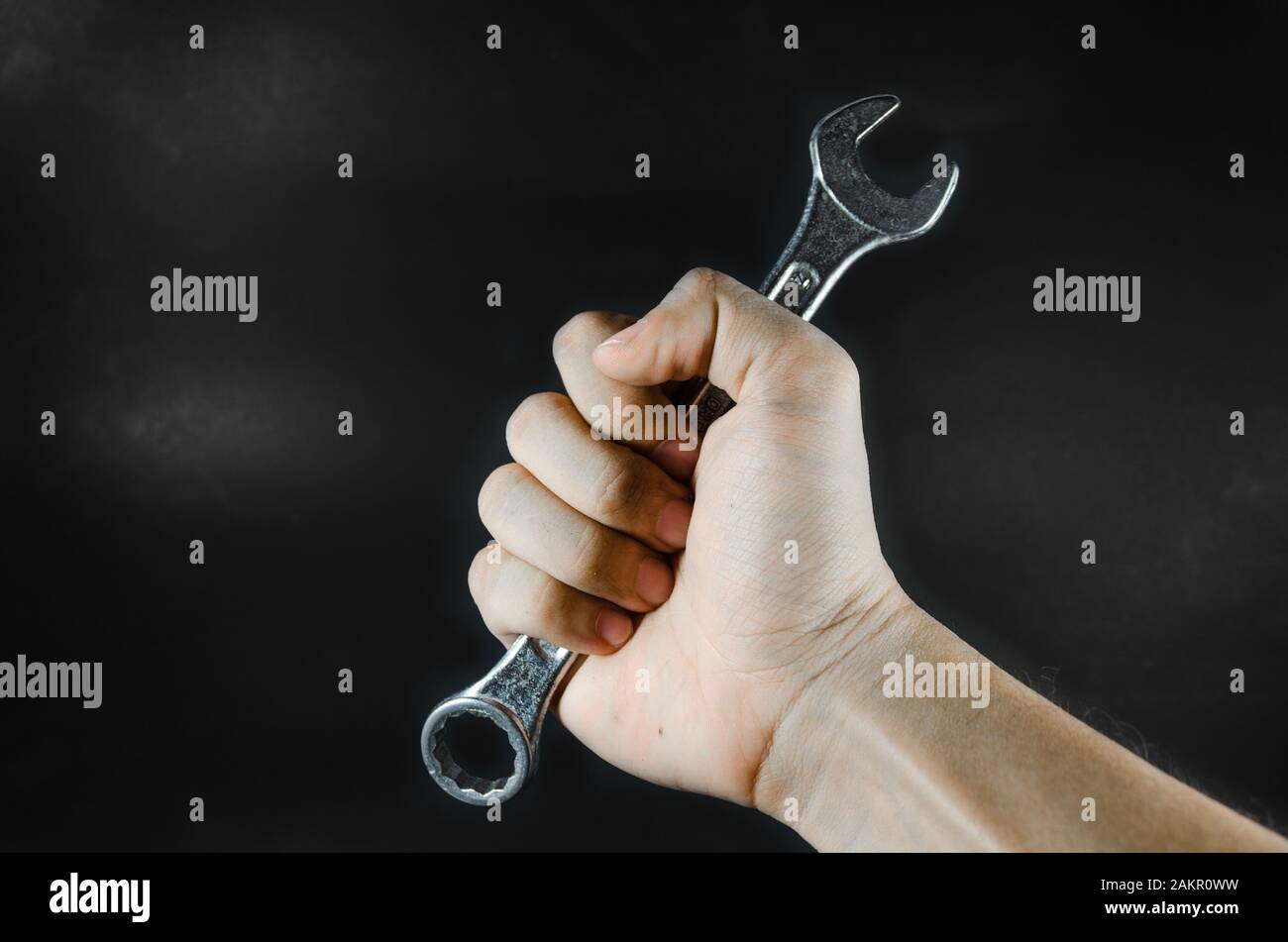 hand hold wrench on blackground Stock Photo
