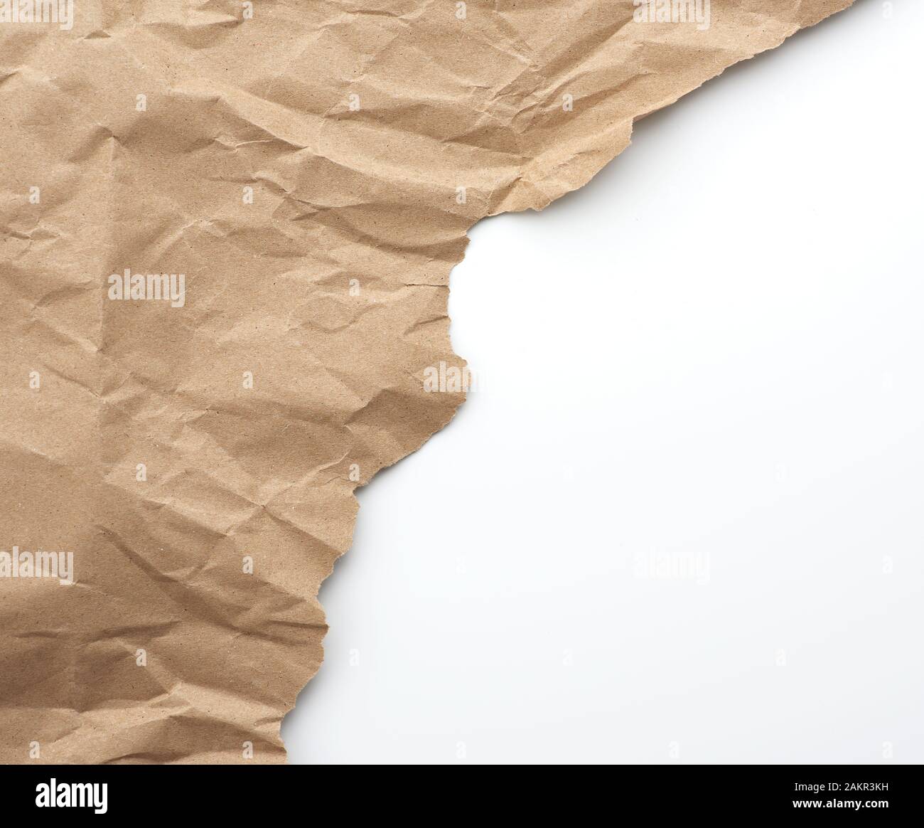fragment of crumpled blank sheet of brown wrapping kraft paper with