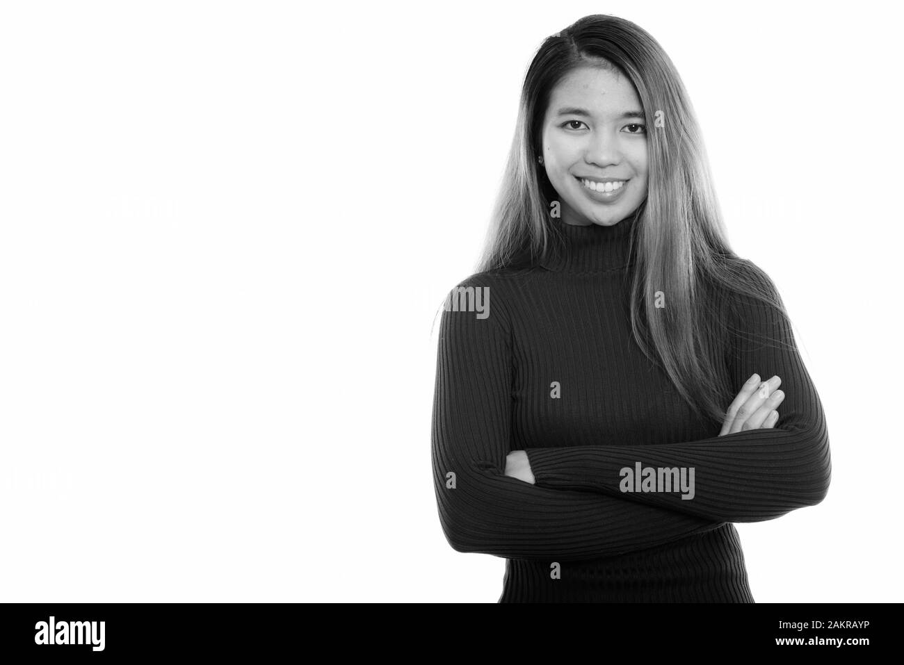 Studio shot of young happy Asian woman smiling with arms crossed Stock ...
