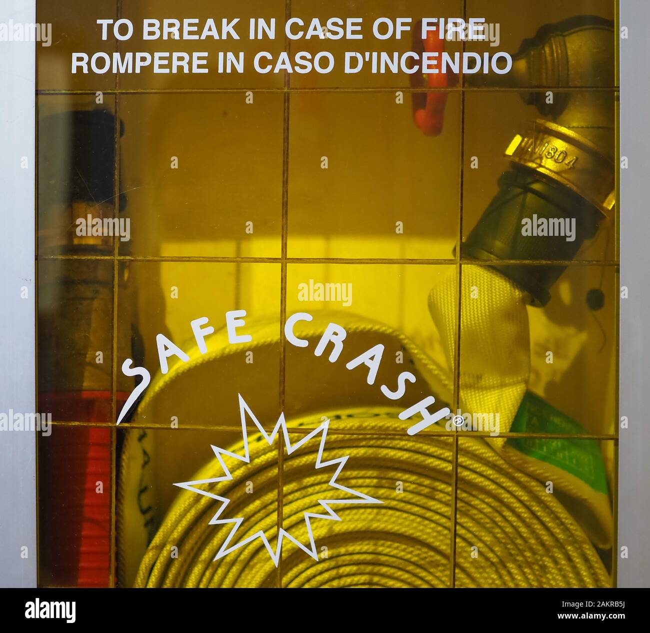 Safe crash fire hose cabinet. Rompere in caso di incendio (translation: to  break in case of fire Stock Photo - Alamy