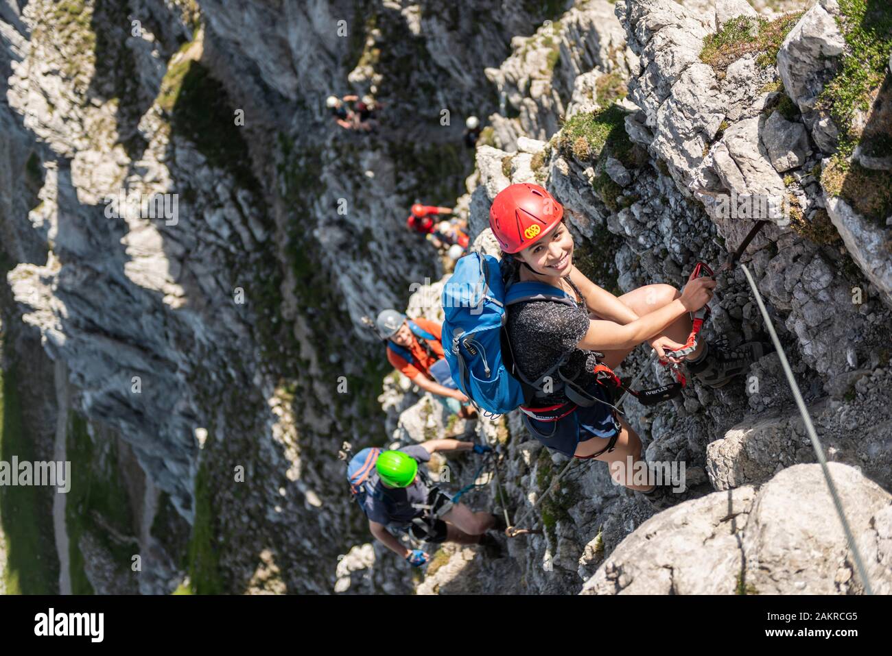 Group of mountaineers with helmet on a secured fixed rope route, Mittenwald via ferrata, Karwendel Mountains, Mittenwald, Germany Stock Photo