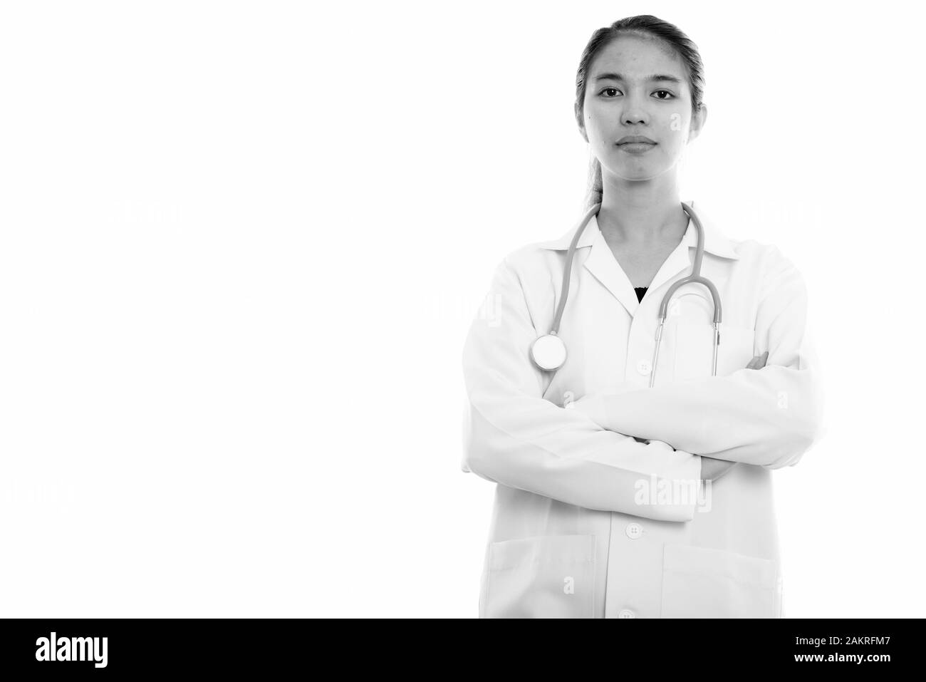 Studio shot of young Asian woman doctor with arms crossed Stock Photo ...