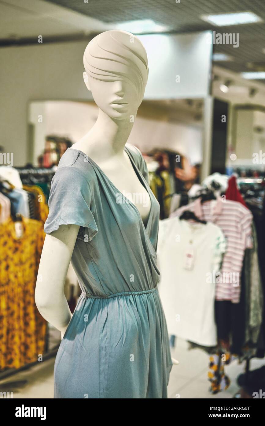 Photo Female Clothes on a Mannequin with Bag. Concepts of Shopping