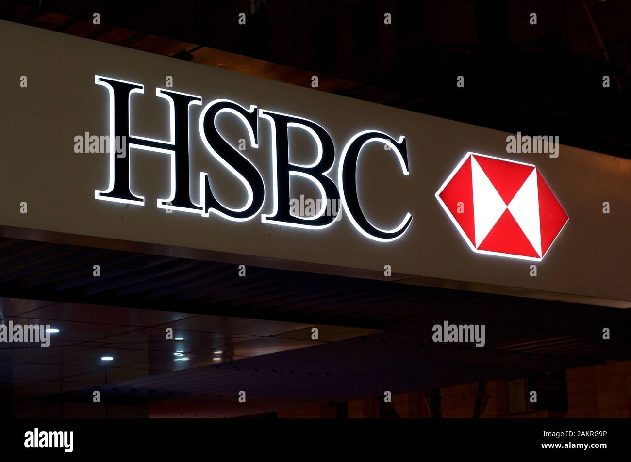 Brisbane, Queensland, Australia - 20th December 2019 : Illuminated HSBC Bank sign hangin in front of the bank building in Brisbane. HSBC Holdings is a Stock Photo