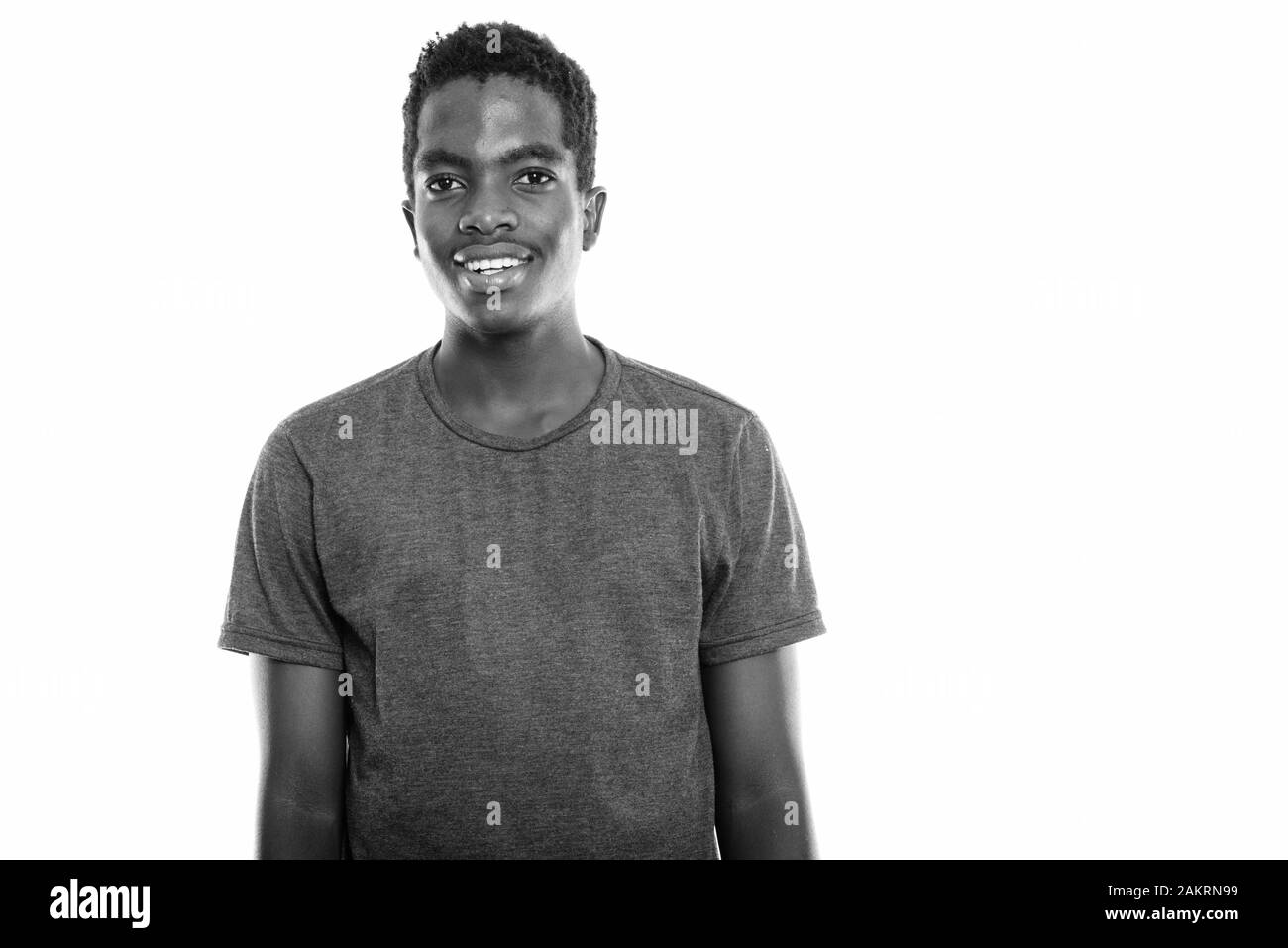 Studio shot of young happy black African teenage boy smiling from Botswana Stock Photo