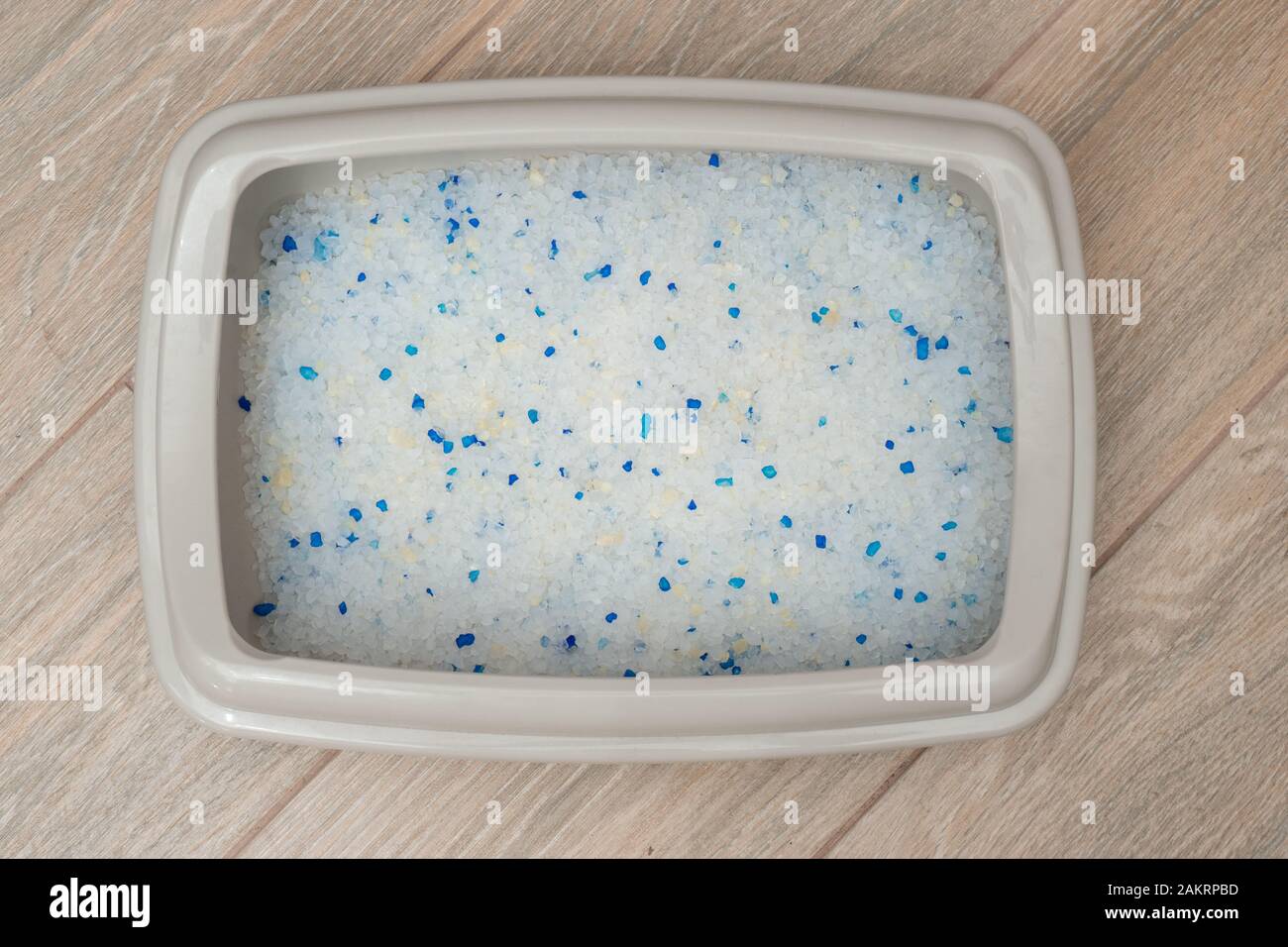 clear Cat litter box on tile floors top view Stock Photo Alamy
