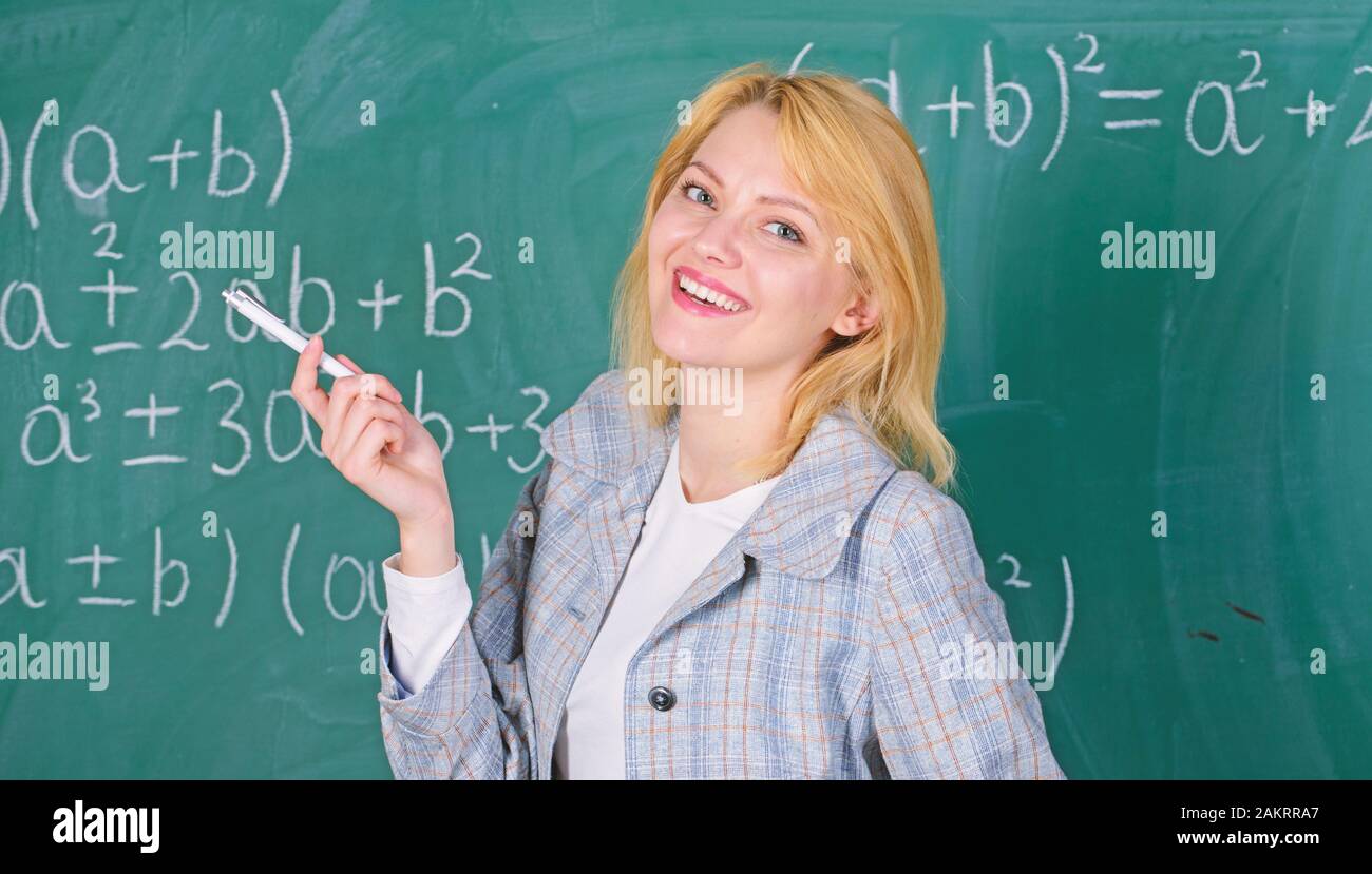 Study and education. Sharing knowledge. Modern school. Knowledge day. teacher on school lesson at blackboard. woman in classroom. Back to school. Teac Stock Photo